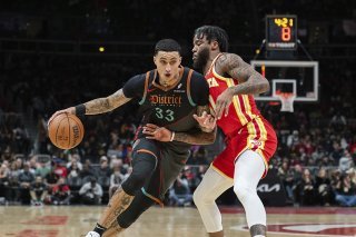 Kyle Kuzma (à gauche) et Washington ont dominé Atlanta samedi KEYSTONE/AP/Hakim Wright Sr.